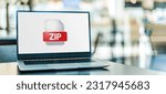 Small photo of Laptop computer displaying the icon of ZIP file