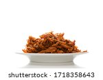 Traditional barbecue pulled pork on plate isolated on white background. Delicious meat eating.