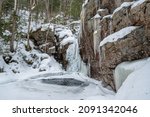 Small photo of Kinsman Falls in Franconia Notch State Park during winter . New Hampshire mountains. USA.
