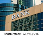 Bank sign on glass wall of...