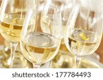 Refreshing White Wine in a Glass on a Background