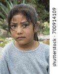 Small photo of Latin expressive little girl Profound glance of a very young harvesting girl