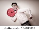 funny businessman with wall clock on gray background
