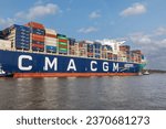 Small photo of Hamburg, Germany - September 28 2023: The ultra large container ship CMA CGM Jacques Saade on the river Elbe entering the Port of Hamburg. CMA CGM is the third largest container shipping company.