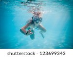 Boy Swimming Under Water In Pool