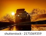 Small photo of Rybachy, RUSSIA - May 30 2022: Off-roading New Land Rover Defender. The Land Rover Defender is a series of British off-road cars and pick-up trucks.