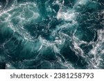 Small photo of Blue waves of water of the river and the sea meet each other during high tide and low tide. Whirlpools of the maelstrom of Saltstraumen, Nordland , Norway.