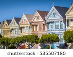 Classic postcard view of famous Painted Ladies, a row of colorful Victorian houses located near scenic Alamo Square, on a beautiful sunny day with blue sky in summer, San Francisco, California, USA