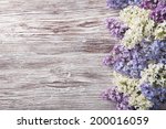 Lilac Flowers On Wood...