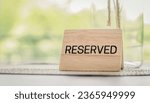 Small photo of Reserved sign on the table. Restaurant reservation service.
