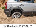 Car Wheel Stuck In The Deep Sand