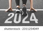 Small photo of Woman's feet ont the road, begin to run, fstart of New year 2024, planning, goal, and new year resolution.