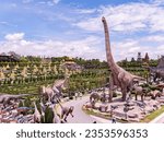 Small photo of Pattaya, Thailand - August 27nd 2023: The French Garden and Dinosaur Park at Nong Nooch Wonder World at Pattaya, Thailand. Nong Nooch is a large park with gardens, flowers, architecture and animals.