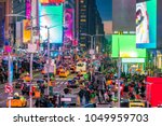 Times Square with neon art and commerce, an iconic street of Manhattan in New York City , United States 