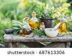 Fresh herbs from the garden and the different types of oils for massage and aromatherapy.