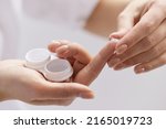 Contact Eye Lenses. Woman Hands Holding Contact Eye Lens. Woman Hands Holding White Eye lens Container. Beautiful Woman Fingers Holding Eye Lens Box. Health And Eyes Care Concept. High Resolution 
