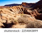 Arid landscape of scenic, rolling sedimentary sandstone and rock formations of Grand Staircase-Escalante National Monument in southern Utah, United States
