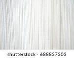 White pleated fabric in the crease pattern for backgrounds and textures. 