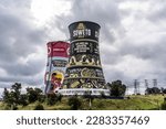 Small photo of SOWETO, SOUTH AFRICA - 01.04.2023, painted Orlando Towers, chimneys at Soweto, South Africa. Orlando towers are a famous landmark of Soweto, the township of Johannesburg.