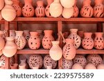 Small photo of Omani Souvenirs. Hand Made Pottery in Nizwa Market. Clay Jars at the Rural Traditional Arabic Bazaar, Oman. Arabian Peninsula.