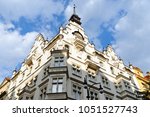 Art Noveau beautifully decorated residential building on Parizska Street - the widest street of the Old Town of Prague, Czech Republic. It is the entrance to the Old Jewish Quarter. The street is full