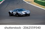 Small photo of Italy, september 11 2021. Vallelunga classic. Ford GT40 race car challenging on asphalt track at circuit turn