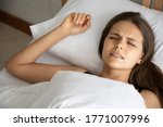 Small photo of stressed woman with grinding teeth, bruxism symptoms; portrait of stressful, exhausted, tired sleeping woman grinding teeth with stress; oral, dental care medical concept; caucasian adult woman model