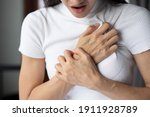 Small photo of woman with sudden heart attack, sick woman suffering from acute heart attack, concept of emergency health care, asian young adult woman model