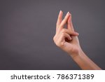 hand snapping finger snap studio isolated; yes, ok, accepting hand, finger snapping for good creative idea; conceptual woman hand snap action gesture concept; woman hand talent model studio isolated