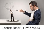 Small photo of Big businessman want to eat small man with cloud messages above his head