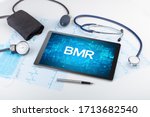 Small photo of Close-up view of a tablet pc with BMR abbreviation, medical concept