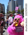 Small photo of SAN FRANCISCO, CA - MAY 12: Colorful pink "gorillas" promote the famous Zazzle Bay-to-Breakers Race to tourists at the Embarcadero on May 12, 2012, in San Francisco, California.