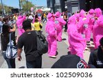 Small photo of SAN FRANCISCO, CA - MAY 12: Colorful pink "gorillas" promote the famous Zazzle Bay-to-Breakers Race to tourists at the Embarcadero on May 12, 2012, in San Francisco, California.