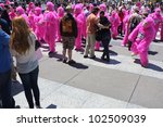 Small photo of SAN FRANCISCO, CA - MAY 12: Colorful pink "gorillas" promote the famous Zazzle Bay-to-Breakers Race to tourists at the Embarcadero on May 12, 2012, in San Francisco, California.