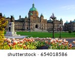 Historic British Columbia provincial parliament building with spring tulips, Victoria, BC, Canada