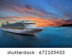 Luxury cruise ship sailing to port on sunrise 