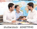 Small photo of Young Man Travel Agent with Clients Concept