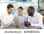 Small photo of Young Man Travel Agent with Clients Concept