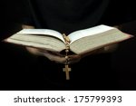 Close Up Of Priest Reading The...