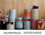 Small photo of Many sizes of beautiful decorative painting handmake craft and art on tin container. Brushes, stationary in tins Reuse, Recycle and Zero waste concept