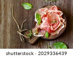 Parma italian dried ham on a wooden board