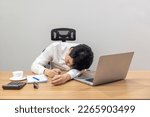 Small photo of Man with narcolepsy is fall asleep on office desk. Narcolepsy is a sleep disorder that makes people very drowsy during the day.