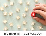 image of wooden blocks with people icon over mint table,building a strong team, human resources and management concept - Image
