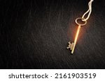 Small photo of Golden key with glowing lights and dark background, wisdom, wealth, and spiritual concept