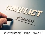 Conflict of Interest, hand writing text attach the letters word to complete concept