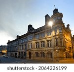 Small photo of HUDDERSFIELD, UK - OCTOBER 26, 2021: The Victorian classical buildings close to Huddersfield train station in the early morning, Kirklees, West Yorkshire