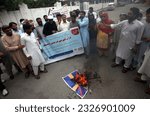 Small photo of PESHAWAR, PAKISTAN - JUL 04: Members of Ehsas Welfare Organization and All Civil Society are holding protest demonstration against desecration of Holy Quran in Sweden, on July 4, 2023 in Peshawar.