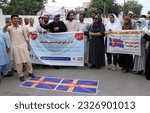 Small photo of PESHAWAR, PAKISTAN - JUL 04: Members of Ehsas Welfare Organization and All Civil Society are holding protest demonstration against desecration of Holy Quran in Sweden, on July 4, 2023 in Peshawar.