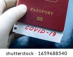 Travel and coronavirus, COVID-19 mark in tourist passport. Medical test at border control due to pandemic. Tourism hit by new variants of corona virus. Restrictions, immigration and travel concept.