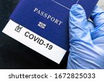 COVID-19, travel, health and lockdown concept, COVID mark in tourist passport. Medical test in airport due to tourism restrictions. Document, passport, corona virus, pass, EU and pandemic theme.